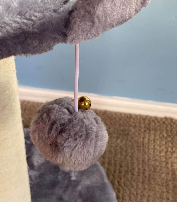 Kitty Cat Post Features a Pom Pom Ball